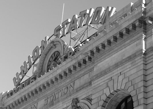 Close-up of an ornate building corner with intricate details.